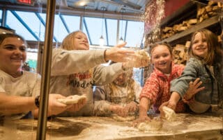 Kids Practice Tossing Pizza Dough at Hard Knox on Kids Eat Free Night