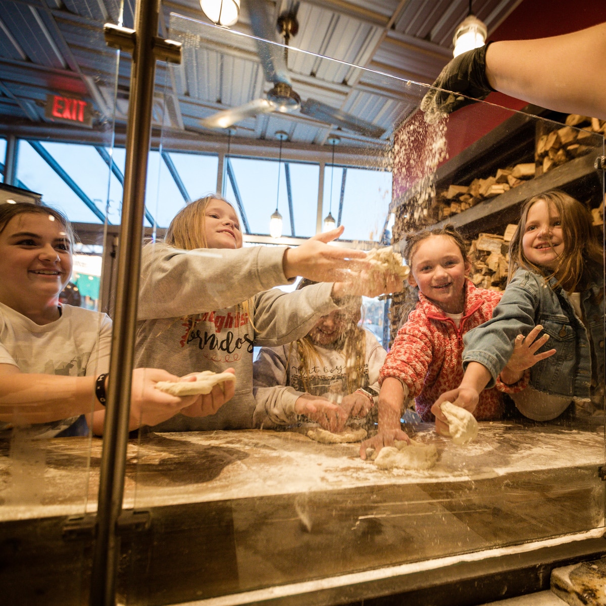 Kids Practice Tossing Pizza Dough at Hard Knox on Kids Eat Free Night